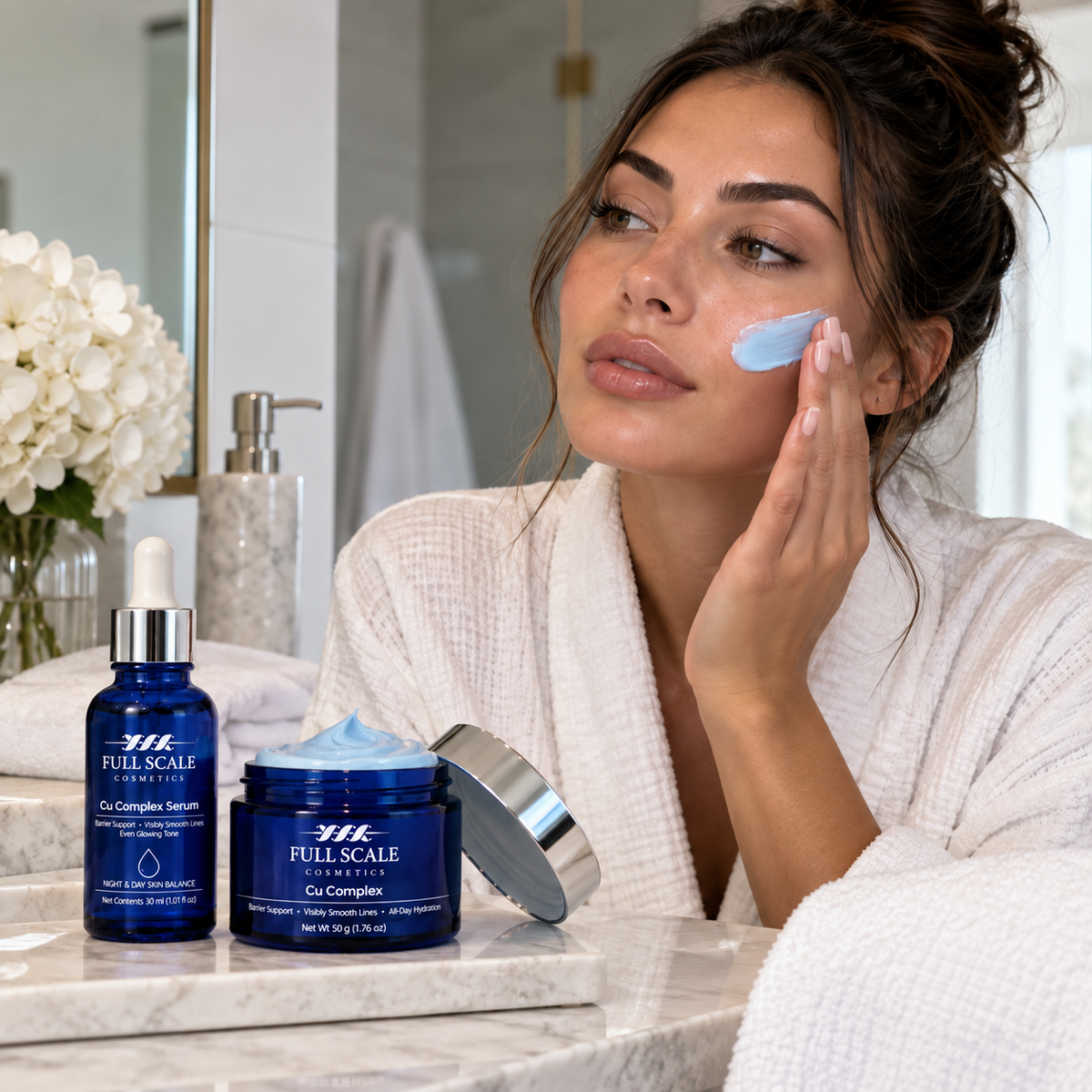 Woman applying blue face cream beside Cu Complex Serum and Cream